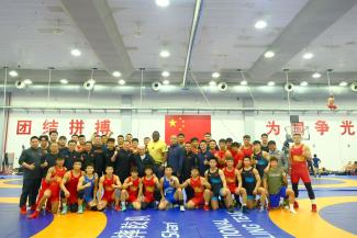 Mijain LOPEZ, coach Ruis DIAZ, and all members of the Chinese Greco-Roman wrestling team