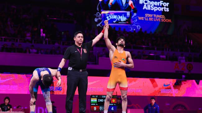 Teen Aman steps up, keeps Asian 57kg title in Indian hands